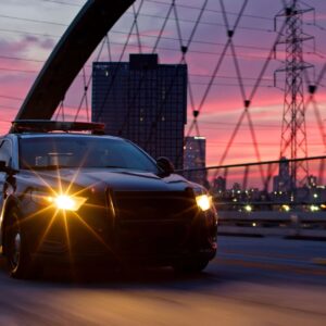 Police Car on Sixth Street Bridge with DTLA Skyline in Background at Sunset